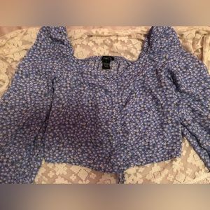 Blue floral rue 21 long sleeve top,size small ,adjustable at the bottom